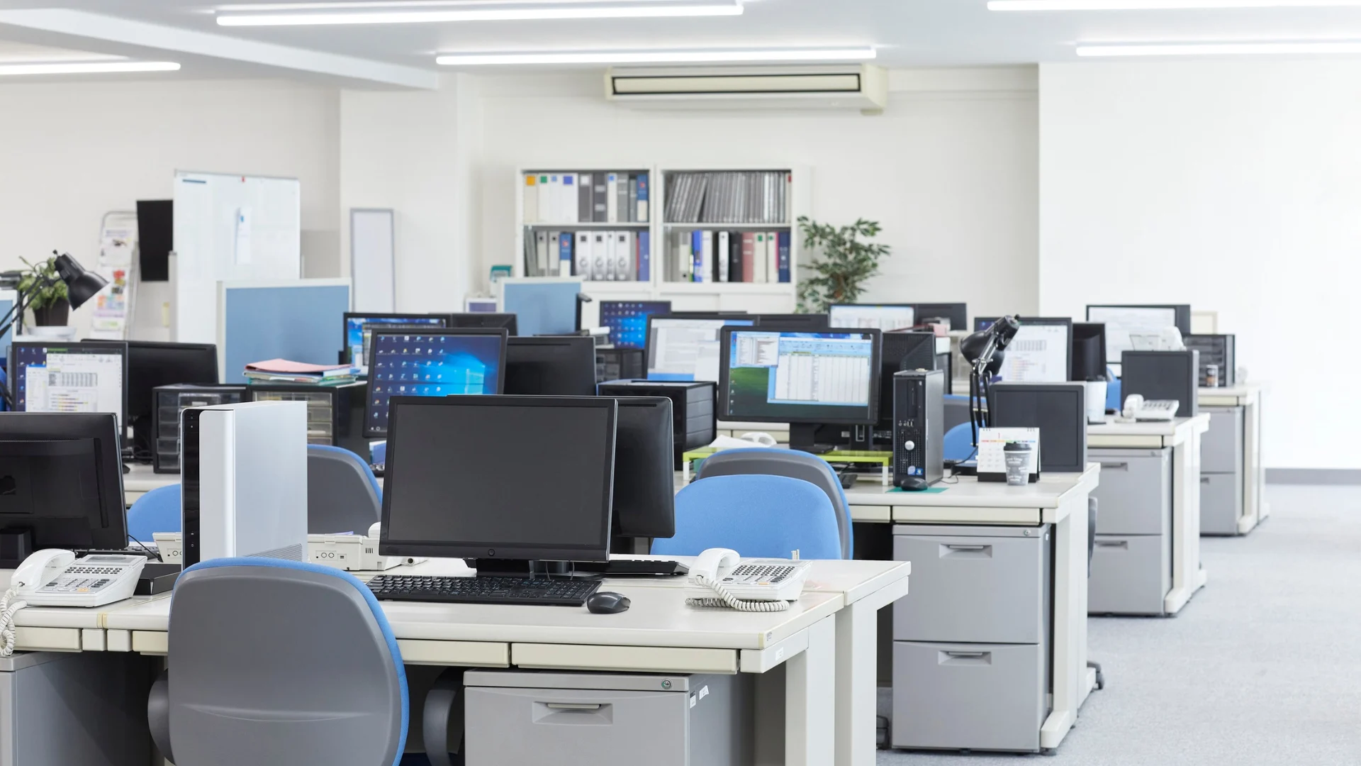 Clean and organized office workspace with desks and computers after professional office cleaning service.